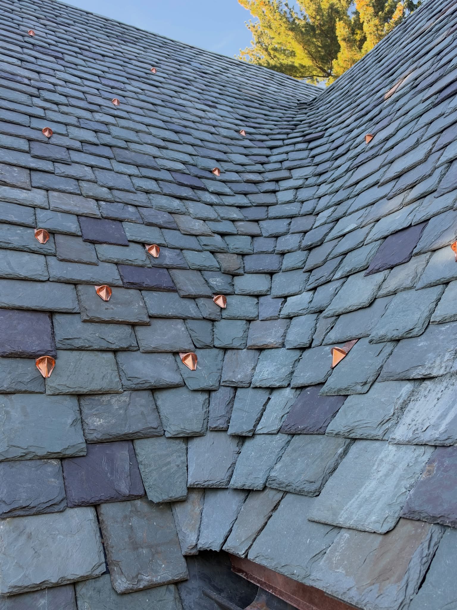 Natural slate roof with copper snow guards by Guild member Gillespie Contracting Inc.